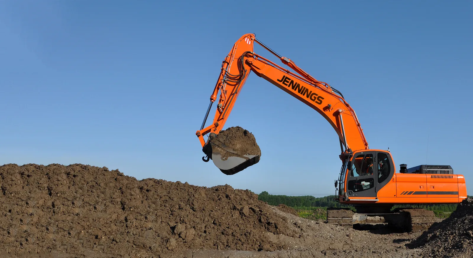 Excavator digging a septic system site in Lakeland, FL